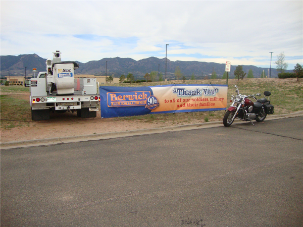 Berwick Electric bucket truck along with one rider's bike